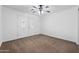 Inviting living room with decorative front door and ceiling fan at 61 S 111Th Pl, Mesa, AZ 85208