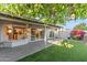 Backyard covered patio with an area of artificial turf at 7819 E Coolidge St, Scottsdale, AZ 85251