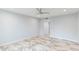 Bedroom featuring tiled floors, ceiling fan, and double door closet at 7819 E Coolidge St, Scottsdale, AZ 85251