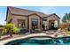 Backyard patio featuring an in-ground pool, built-in grilling station, and a covered lanai at 8304 E Inca St, Mesa, AZ 85207