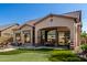 Outdoor patio and pool featuring a built-in grilling station, in-ground pool, and a putting green at 8304 E Inca St, Mesa, AZ 85207