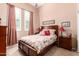 Cozy bedroom with plantation shutters, neutral walls, and a comfortable bed at 8304 E Inca St, Mesa, AZ 85207