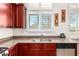 Kitchen featuring stainless steel appliances, granite countertops, stainless sink and a large window at 8304 E Inca St, Mesa, AZ 85207