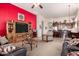 Open living area showcasing a seamless transition into a spacious kitchen and a modern entertainment setup at 8304 E Inca St, Mesa, AZ 85207