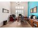 Bright office with white plantation shutters, modern desks and seating, and a vibrant blue accent wall at 8304 E Inca St, Mesa, AZ 85207