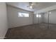 Bedroom showcasing neutral carpet, large mirror closet, a window with natural light at 913 N Trekell Rd, Casa Grande, AZ 85122