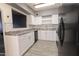 Updated kitchen featuring modern appliances, white cabinets, and gray countertops at 913 N Trekell Rd, Casa Grande, AZ 85122