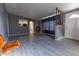 Open living room with gray walls, light-colored floors, transom windows, and ample natural light at 913 N Trekell Rd, Casa Grande, AZ 85122