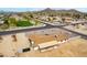 Aerial view of a neighborhood showcasing a vacant lot, offering endless possibilities for future construction at 9305 W Calle Lejos --, Peoria, AZ 85383