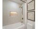 Bright bathroom features shower-over-tub with brushed gold fixtures and decorative wall art at 9305 W Calle Lejos --, Peoria, AZ 85383