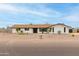 Charming single-story home featuring a white brick exterior, black trim, and a well-manicured front yard at 9305 W Calle Lejos --, Peoria, AZ 85383