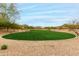 A community green space showcasing well-maintained grass and natural desert vegetation for a tranquil setting at 9305 W Calle Lejos --, Peoria, AZ 85383