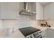 Close-up of a modern kitchen with sleek appliances, white cabinetry, and stylish backsplash at 9305 W Calle Lejos --, Peoria, AZ 85383