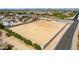 Aerial view of a large vacant lot with surrounding greenery, perfect for building a custom home at 9305 W Calle Lejos --, Peoria, AZ 85383