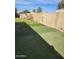 Spacious backyard featuring synthetic turf for low maintenance, bordered by a block wall at 934 S Evangeline Ave, Mesa, AZ 85208