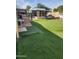 Large backyard featuring synthetic grass, offering an expansive and low-maintenance outdoor space at 934 S Evangeline Ave, Mesa, AZ 85208