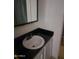 Bathroom vanity with black countertop at 934 S Evangeline Ave, Mesa, AZ 85208