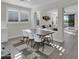 Bright dining area with natural light, wood table, and stylish seating at 9477 W Tonopah Dr, Peoria, AZ 85382