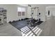 Bright home gym features workout equipment and ample space for various fitness activities at 9477 W Tonopah Dr, Peoria, AZ 85382