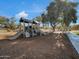 Community playground area featuring slides and play structures for entertainment at 9477 W Tonopah Dr, Peoria, AZ 85382