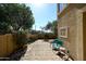 Charming backyard featuring a brick-paved patio with seating and lush landscaping at 10218 N 12Th Pl # 2, Phoenix, AZ 85020