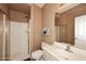 Cozy bathroom with a walk-in shower, updated vanity and light fixtures at 10218 N 12Th Pl # 2, Phoenix, AZ 85020