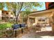 Community grilling area with two gas grills, tables, and chairs at 10218 N 12Th Pl # 2, Phoenix, AZ 85020