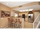 Bright kitchen featuring stainless steel refrigerator, breakfast bar, and plenty of cabinet space at 10218 N 12Th Pl # 2, Phoenix, AZ 85020