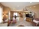 Open-concept living room showcases natural light, tile floors, and a staircase to the second floor at 10218 N 12Th Pl # 2, Phoenix, AZ 85020