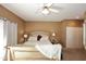 Serene main bedroom features neutral tones, ceiling fan, and large windows for natural light at 10218 N 12Th Pl # 2, Phoenix, AZ 85020