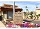 Elegant entrance sign for Pointe Resort Condominiums at Tapatio Cliffs with beautiful flowerbeds at 10218 N 12Th Pl # 2, Phoenix, AZ 85020