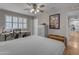 Cozy bedroom with ample natural light, a ceiling fan, and neutral decor at 10226 W Snead S Cir, Sun City, AZ 85351