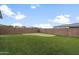 Spacious backyard with a putting green and tall block wall offering privacy at 10322 E Topaz Ave, Mesa, AZ 85212