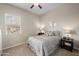 Cozy bedroom featuring a plush carpet, a neutral color scheme, and natural light at 10322 E Topaz Ave, Mesa, AZ 85212