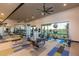 Well-equipped gym with modern fitness machines and ample workout space overlooking a green area at 10322 E Topaz Ave, Mesa, AZ 85212
