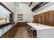 Modern kitchen featuring sleek cabinets, an expansive island with breakfast bar, and upscale appliances at 10322 E Topaz Ave, Mesa, AZ 85212