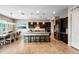 Open kitchen featuring a large island, stainless steel appliances, and pendant lighting at 10322 E Topaz Ave, Mesa, AZ 85212