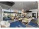 Elegant lounge area with comfortable seating arrangements, stylish decor, and ample natural light at 10322 E Topaz Ave, Mesa, AZ 85212