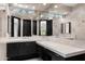 Well-lit bathroom with dual sinks, vanity area, and large mirrors overlooking the patio at 10324 E Calle De Las Brisas --, Scottsdale, AZ 85255