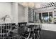 Modern dining room featuring decorative wall accents, stylish furnishings and sleek black tile flooring at 10324 E Calle De Las Brisas --, Scottsdale, AZ 85255