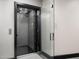 Modern elevator with stylish wall design, lighting, and a glass door at 10324 E Calle De Las Brisas --, Scottsdale, AZ 85255