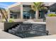 Contemporary home entrance featuring a black staircase waterfall leading to the front doors at 10324 E Calle De Las Brisas --, Scottsdale, AZ 85255