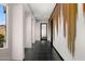 Bright hallway with black tile flooring and a unique accent wall with views of the mountains at 10324 E Calle De Las Brisas --, Scottsdale, AZ 85255