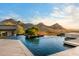 Stunning infinity pool with mountain views and water features, perfect for relaxing and entertaining at 10324 E Calle De Las Brisas --, Scottsdale, AZ 85255