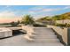 A modern water feature cascading down stairs with lush landscaping and serene mountain views at 10324 E Calle De Las Brisas --, Scottsdale, AZ 85255