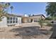 Serene backyard featuring a covered patio, low maintenance landscaping, and lush greenery, offering a private outdoor space at 10421 E Silvertree Dr, Sun Lakes, AZ 85248