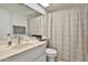 Bathroom featuring a shower-tub combo with tile surround and a single sink vanity at 10421 E Silvertree Dr, Sun Lakes, AZ 85248