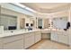 Bright bathroom with tile flooring, a skylight and a long single sink vanity at 10421 E Silvertree Dr, Sun Lakes, AZ 85248