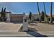 Charming single-story home featuring a two-car garage and desert landscaping at 10421 E Silvertree Dr, Sun Lakes, AZ 85248