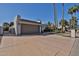 Lovely single-story home featuring desert landscaping, wide driveway, and an attached two-car garage at 10421 E Silvertree Dr, Sun Lakes, AZ 85248